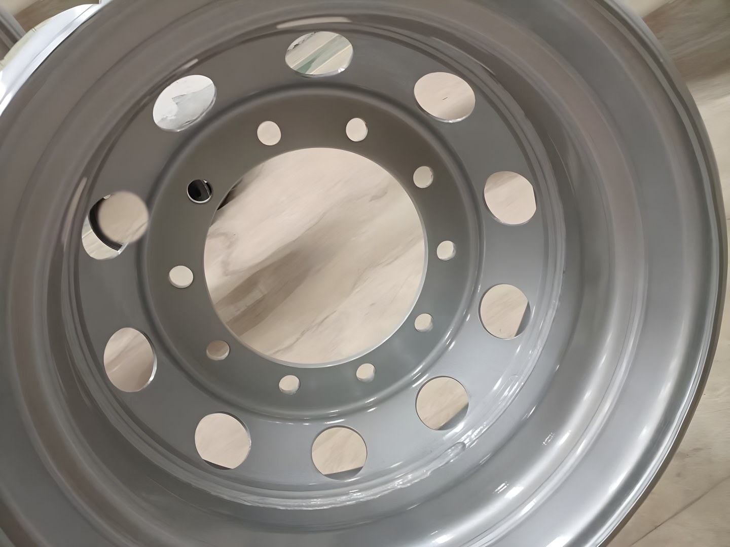Bolt holes on the disc of a tubeless steel truck wheel